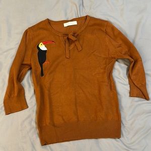 Women’s sweater top. Three quarter length sleeves. Retro, 50’s, vintage style.